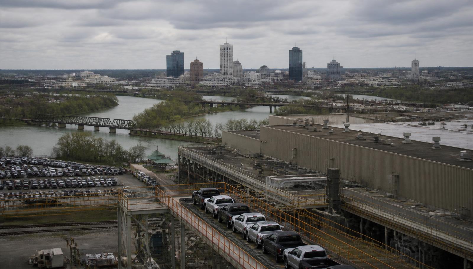 Fort Wayne Indiana industrial skyline with defense electronics facilities at golden hour